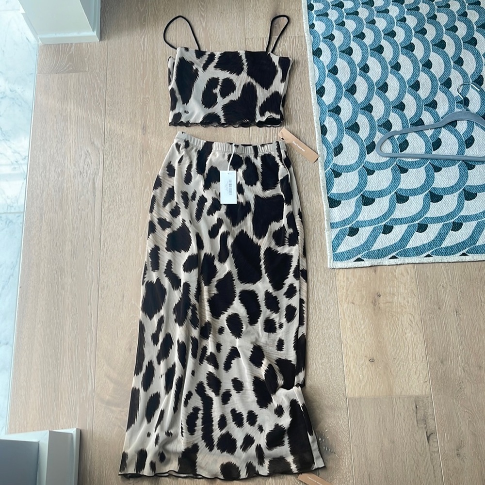 Brand new tags on reformation skirt and crop set. Size XS.